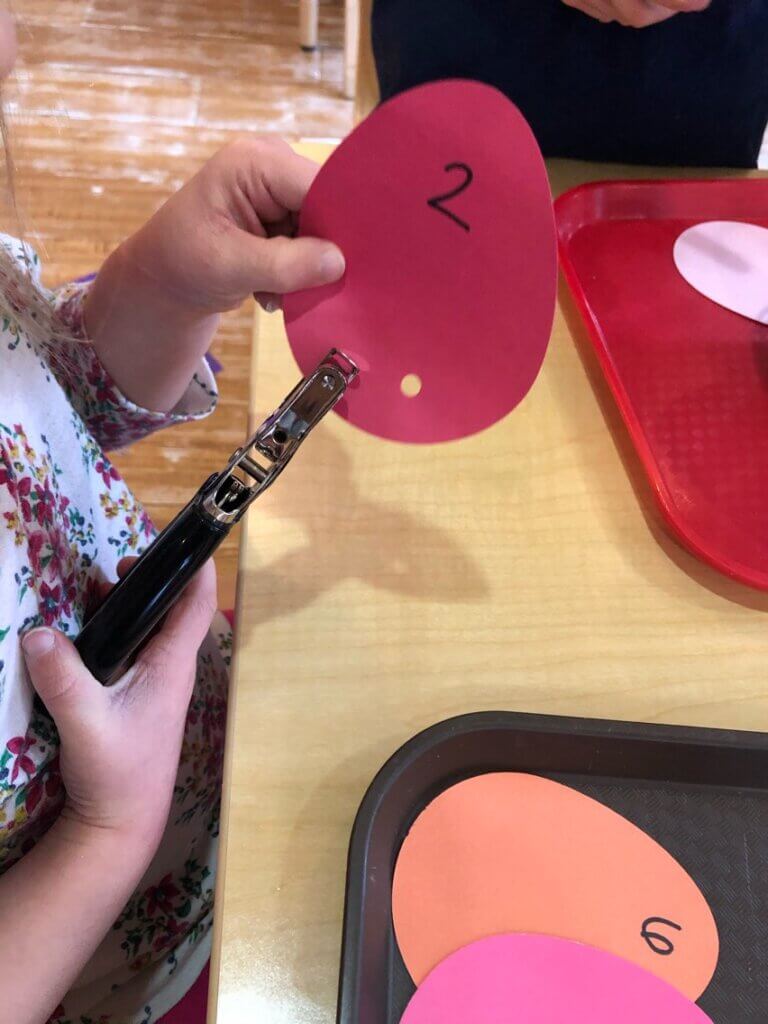 A child doing a numbers exercise at Early Learning For Everyone