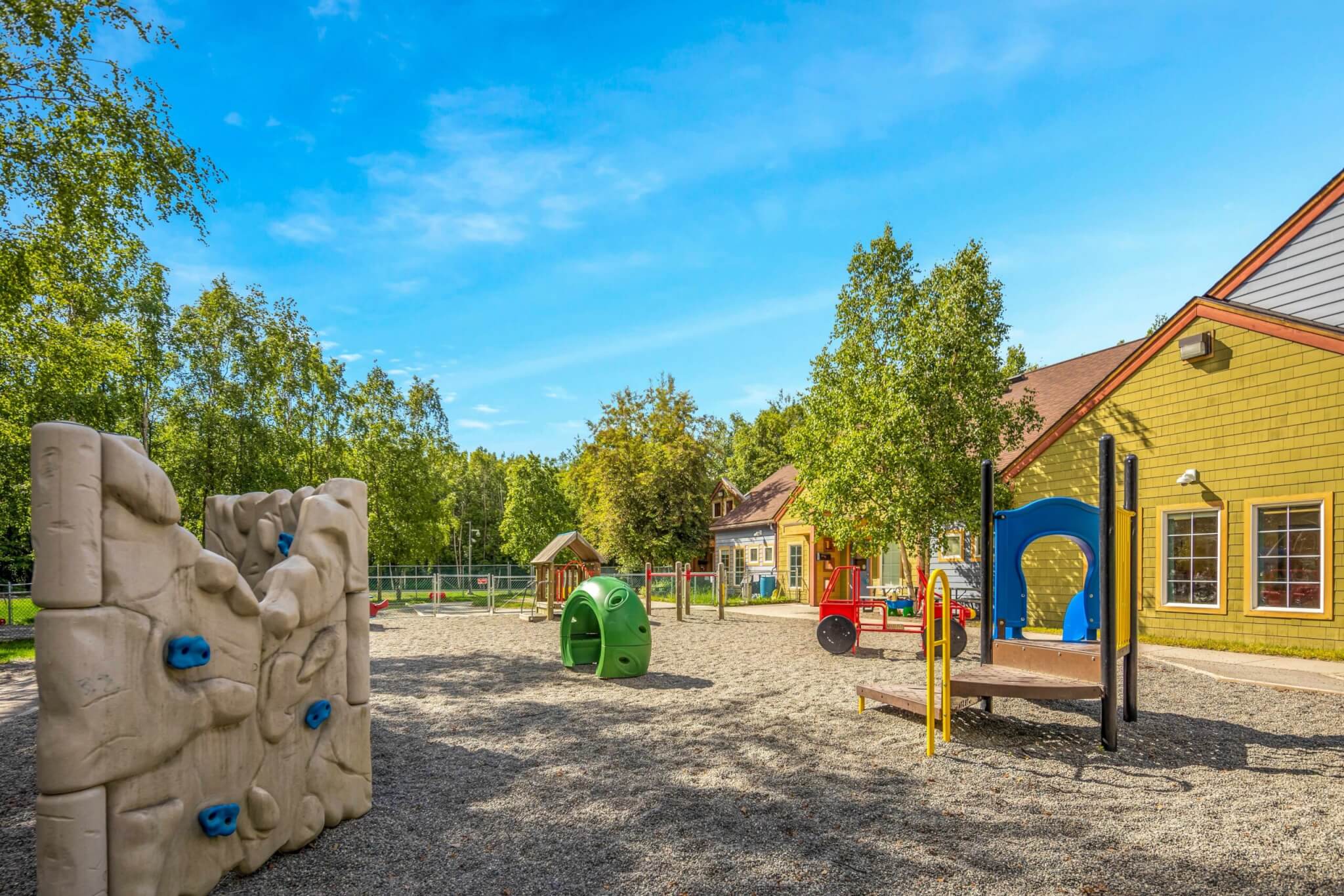 Outdoor playground and climbing wall for kids at Early Learning For Everyone