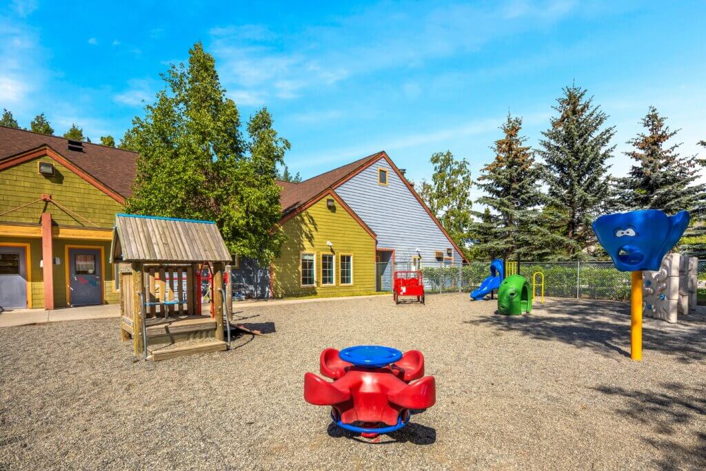 Playground with several structures for kids at Early Learning For